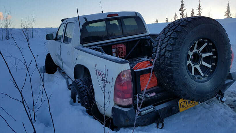 Driving in winter conditions poses the risk of getting stuck in a snowbank